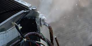 Fix4U Repairs' technicians fixing ac leaking problem in GTA  